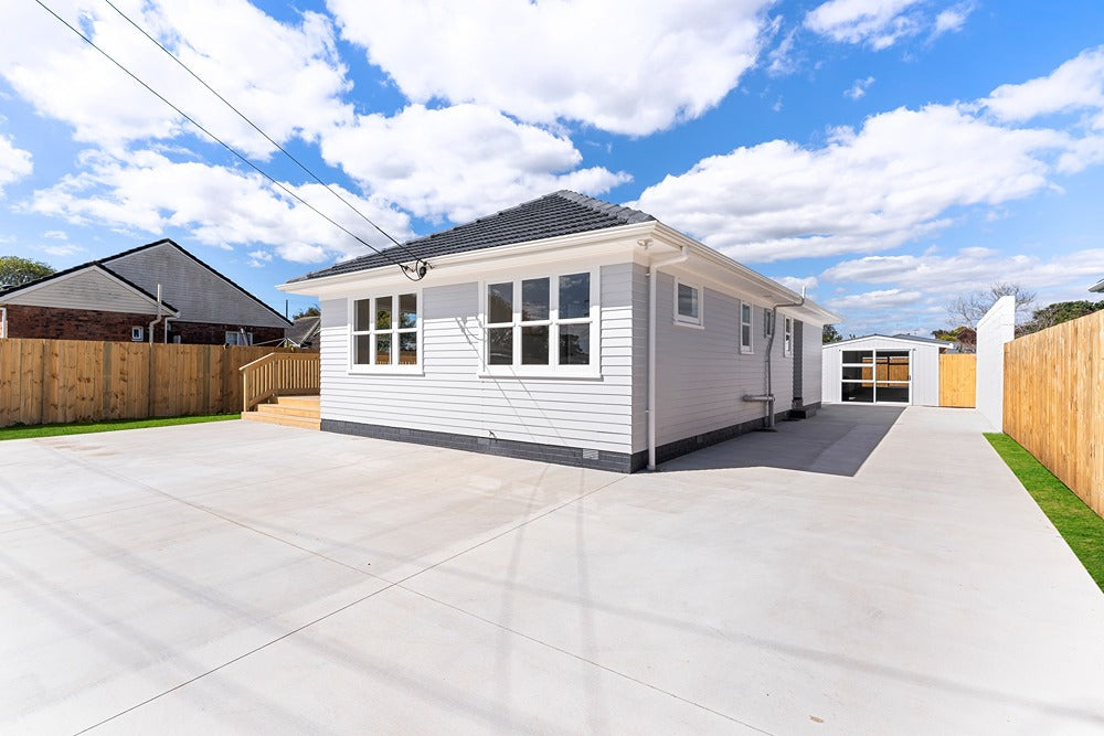 Renovated 1940s weatherboard house in Ōtara with new side deck and driveway