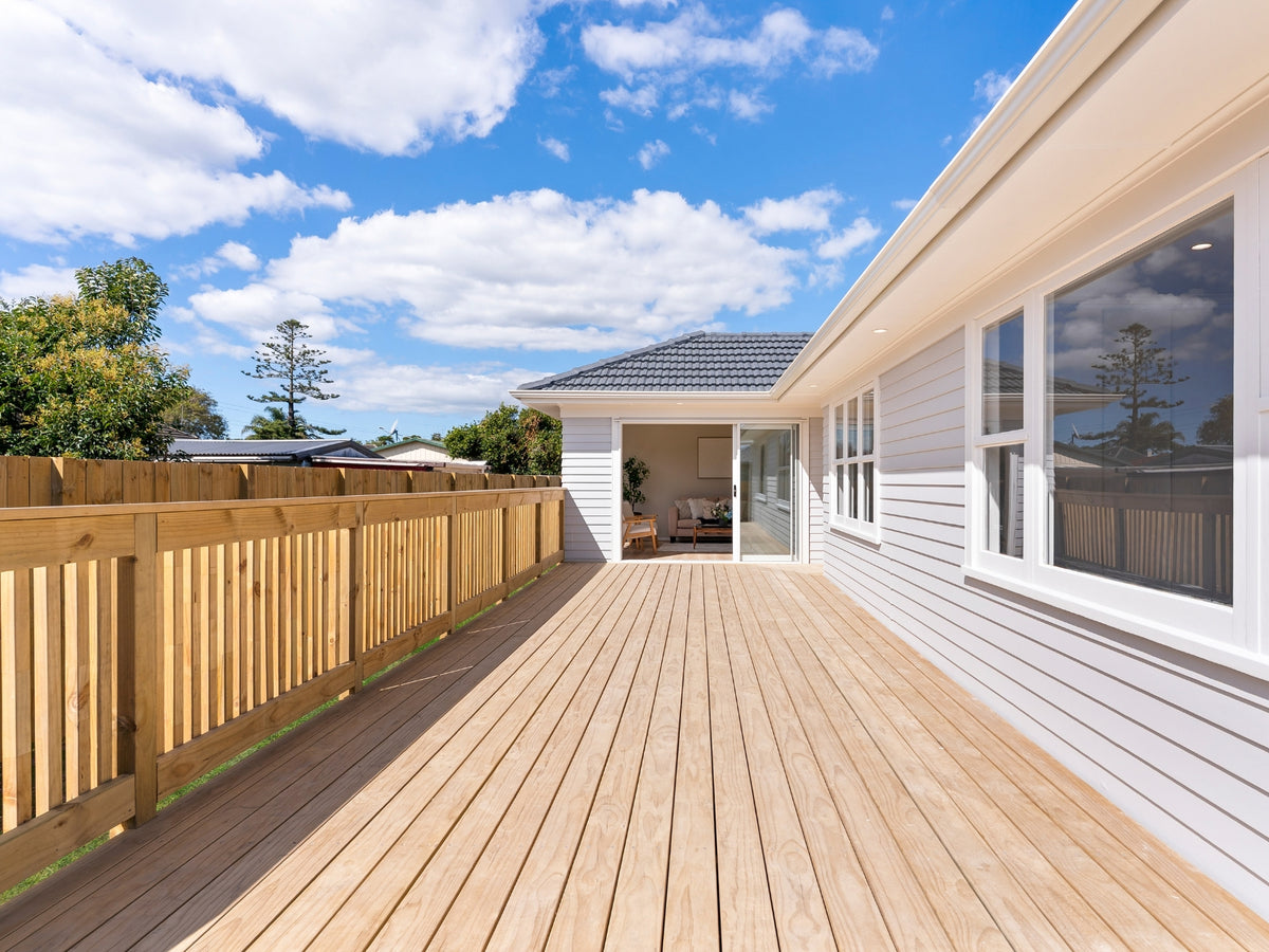 New side deck with timber balustrade along the renovated house