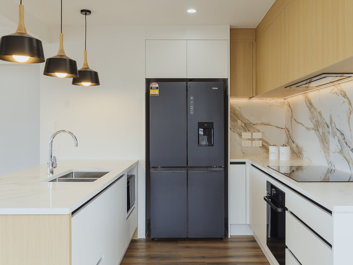 Kitchen with space for a full-height fridge and a tall pantry